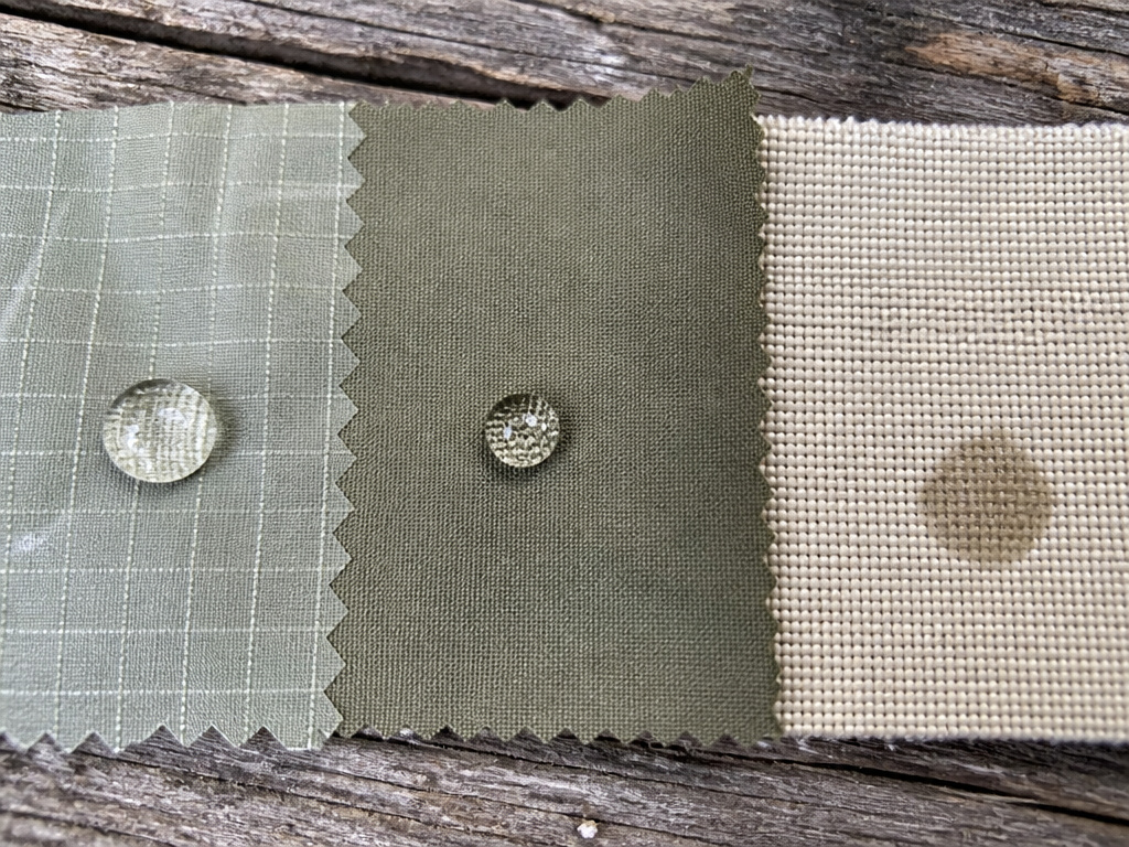 Close-up comparison of nylon, polyester, and canvas tent fabric swatches.