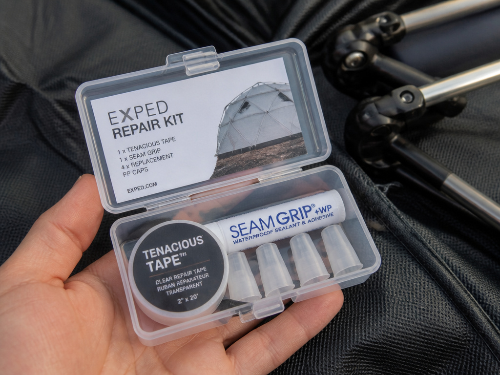 Essential pop-up tent repair kit with tape, glue, and spare parts.