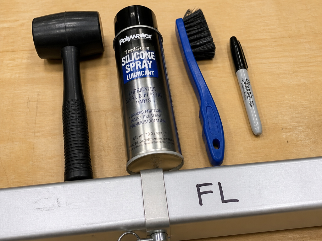 Four tools for safely folding a canopy tent to prevent damage.